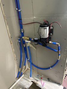 Install water lines for tanks and pumps